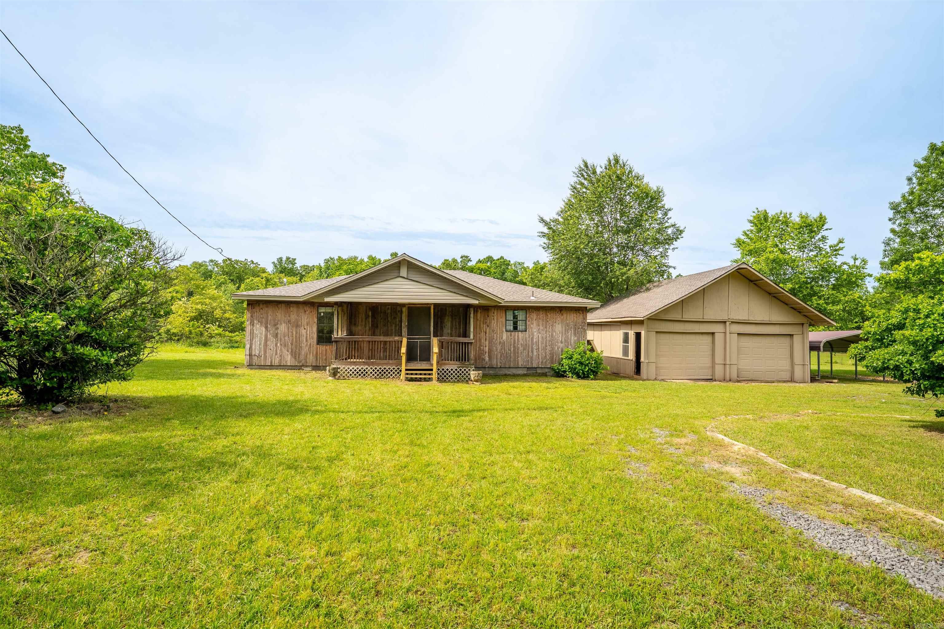 COUNTRY HOME CLOSE TO TOWN!!! BEAUTIFUL ROLLING HILL OF 15 ACRES , SEDA SIDING 2 BED , 1.5 BATH , 1408 SQ .FT , STOCK POND FULL OF CATFISH, CREEK , GARDEN AREA CITY & WELL WATER, OUTSIDE BRICK STOVE FOR PICNIC, TWO CARS GARAGES, FRONT PORCH, NEW ARCHITECTURAL ROOF SHINGLES BOTH HOUSE & GARAGE , NEW BACK DECK TO RELAX , AWESOME A.S.U BEEBE & SCHOOLS , ALL SHOPPING AREA. ONE YEAR HOME WARRANTY PROVIDED BY THE SELLER !! Agents see confidential remarks