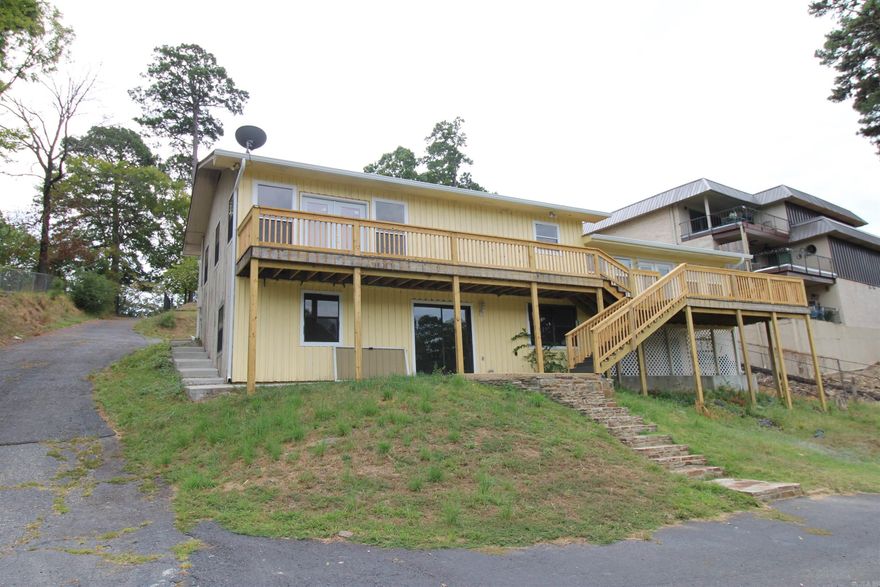 Great views at this lake house with 2 boat slips.  4 large bedrooms, new flooring throughout.  Lots of cabinet space in the Kitchen with new appliances.  New Deck.