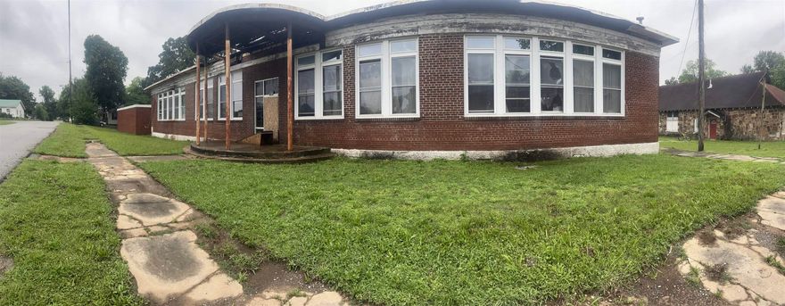 Historic Redevelopment Opportunity – 19,000± Sq Ft Main Building with 3,500± Sq Ft Adjacent Shop on 1.04 Acres  Discover the potential of this remarkable historic property located in the heart of Newark, Arkansas. Spanning approximately 19,000 square feet, the primary building offers an expansive single-story layout, ideal for a wide range of redevelopment possibilities. Situated on a generous 1.04-acre lot, the property also includes a 3,500± square foot shop building, providing additional space for storage, workspace, or complementary use.  Constructed with solid concrete foundations and durable brick and cinderblock exterior walls, this structure offers a strong and stable shell — ready to be reimagined. Whether you're an investor, developer, or entrepreneur, this property presents a rare opportunity to restore and customize a sizable footprint to suit virtually any commercial, industrial, or mixed-use vision.  From its historic charm to its structural integrity and size, this property is a blank canvas with endless possibilities for transformation.