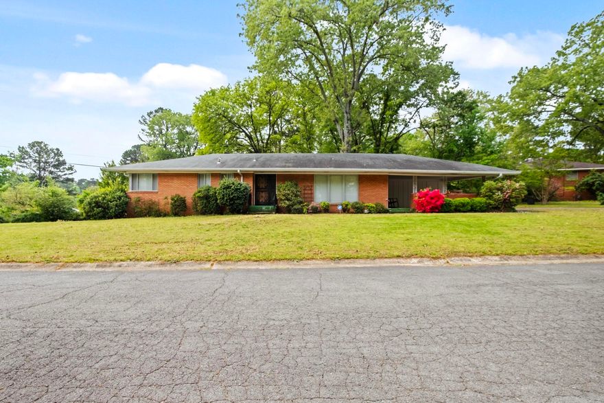 Darling home in the heart of Little Rock.  This all brick home sits on a larger corner lot and features 3 bedrooms and 2 full baths.  Kitchen is has white cabinets, glass tile back splash, stainless appliances and a breakfast bar.   Kitchen/dining combo with built in desk area.  Living room has wood floors and large windows with views of front yard.  3 good sized bedrooms. Fully fenced backyard with side entry carport.   Just minutes to interstate access, shopping, food and Boyle Park.