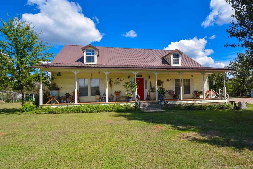 Vac yr around in your own lodge! Very open concept! 4BR/2.5Ba's, living room with fireplace, large kitchen! Home is on 5.01 acres with lake and boat dock, lots of landscaping, fruit trees, garden, green house, and storage building. Must see if you like the country! New HVAC will installed by seller upon accepted offer. See remarks for showing.