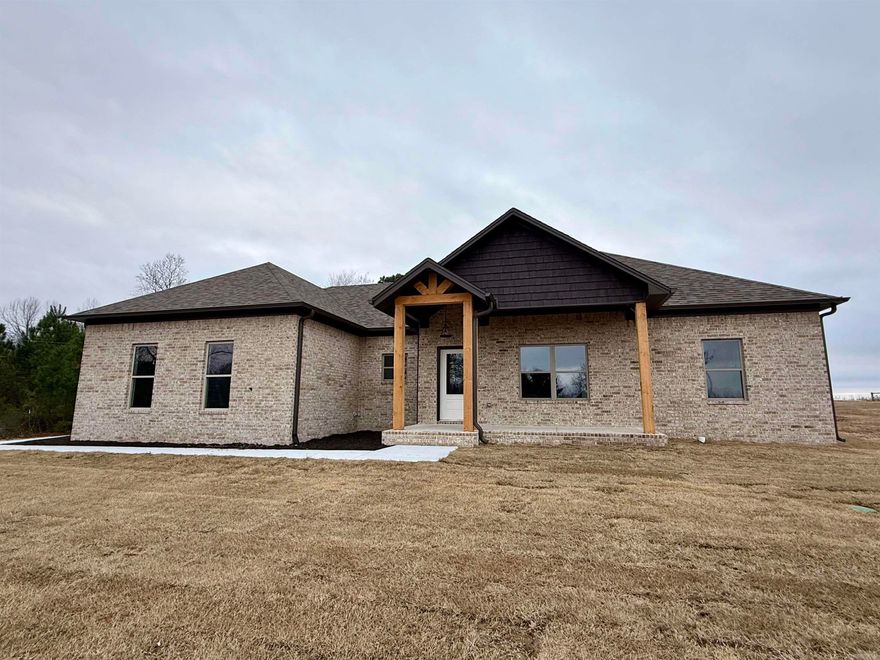 Fantastic new construction home on just under 1 acre. This home has some nice extras: High ceiling in the living room, attractive vent hood above the stove, electric fireplace, granite countertops, huge pantry with microwave in the pantry, island, laminate vinyl plank flooring throughout and a large laundry room with lots of cabinets. Backyard is partially fenced. Completion at the end of December.