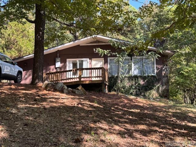PARTIALLY RENOVATED HOME ON .71 ACRE! 1462 square foot home has 3 bedrooms and 1 recently remodeled bathroom with double sink and granite countertops. Kitchen with pantry, coffee bar and dining room and living room combo. Huge laundry room. Rock hearth and fireplace with wood burning insert. The home is handicapped accessible with front ramp, wheelchair accessible kitchen sink and spacious open floor plan. New roof in 2023 and new central heat and air in 2017 and new flooring and bathroom in 2022. The home is all electric with average bill being $140 with stove, refrigerator, washer and dryer all staying. Home sits on .71 of an acre surrounded by woods. Just 30 miles from Pocahontas close to lakes and rivers!