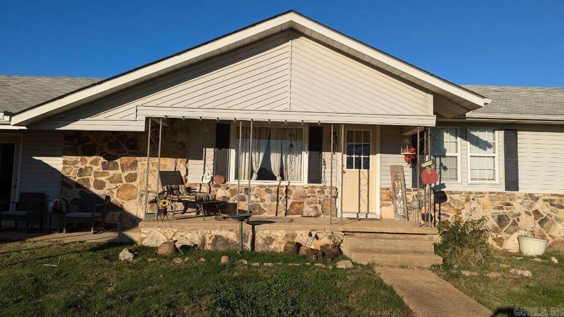 New Roof in 2025!! This mini-farm just waiting for you! Large family home on small non-restricted acreage! This home has 3 bedrooms 2 baths with a large living room, family room, all new appliances and ceiling fans and two wells for water. It has a new, roomy storm shelter. Sets on 4 acres m/l with a fenced pasture, small stocked pond, fruit trees, and a chicken coop. Barn has tack/feed room, 2-10 x 10 horse stalls, and a workroom. Beautiful setting and secluded on a paved road. Close to town and all the amenities with just a short drive to Mt. Home. The rustic look of the sunken living room is sure to catch your eye. Property is currently being used for horses or can be used for other livestock as well.