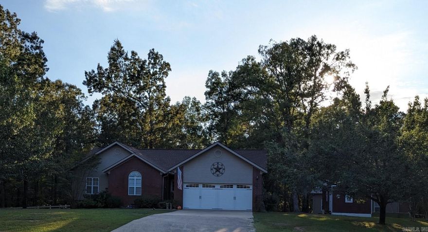 This 3-bedroom 2 Bath home on 1.5 acre lots in the charming Fox Run Village neighborhood just 1 minute from the Devils Fork Boat launch on beautiful Greers Ferry Lake. Plenty of room for your Boat and lake toys in the fully insulated temperature controlled 30 X 40 X 12 shop plus covered storage for your RV. Property has a separate workshop with electricity, full roll up door, work bench and plenty of storage room for all of your hobbies. This home has been remodeled in the past 5 years and features a great room and a fully enclosed screened porch plus a large Timber Tech low maintenance deck for your outdoor entertaining or simply relaxing and listening to the seasonal creek that runs through the rear of the property. Home has many upgrades including new roof, new HVAC unit, new flooring, fully remodeled Primary bathroom with large custom walk-in shower. Two adjacent lots totaling 1.69 additional acres is also available for sale. Come check out this Lake home in the Ozarks!