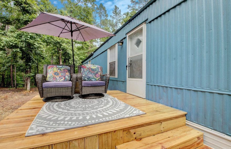 Adorable 3-bedroom, 2-bath mobile home situated on a spacious one-acre lot! This move-in ready home offers the perfect blend of comfort and convenience, with plenty of room to park your boat, ATV, or lake toys—and a neighborhood boat launch just minutes away. Ideal as a full-time residence, vacation getaway, or short-term rental. Inside, you'll find beautiful laminate flooring throughout, a gorgeous eat-in kitchen that opens to the living room, and a desirable split floor plan for added privacy. Don’t miss this opportunity—call me today to schedule your private showing!