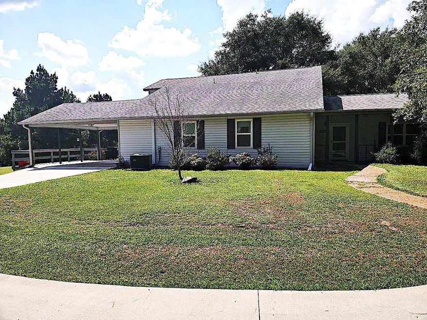 This up-to-date modern farmhouse features 4 bedroom and 3 full baths, and many extras. The kitchen, dining room and living room are all arranged in an open floor plan with granite counter tops and stainless appliances in the kitchen. There is plenty of room for an office separate from the bedrooms. Outside, the 2 car detached garage sits seconds away from the 2-car covered carport.  A separate workshop has lots of storage space and places for tools, boats and 4-wheelers.  There is also a Generac generator, fenced orchard/garden area, stock pond, chicken coop and barn on the acreage. Don't miss out on country living at its best!