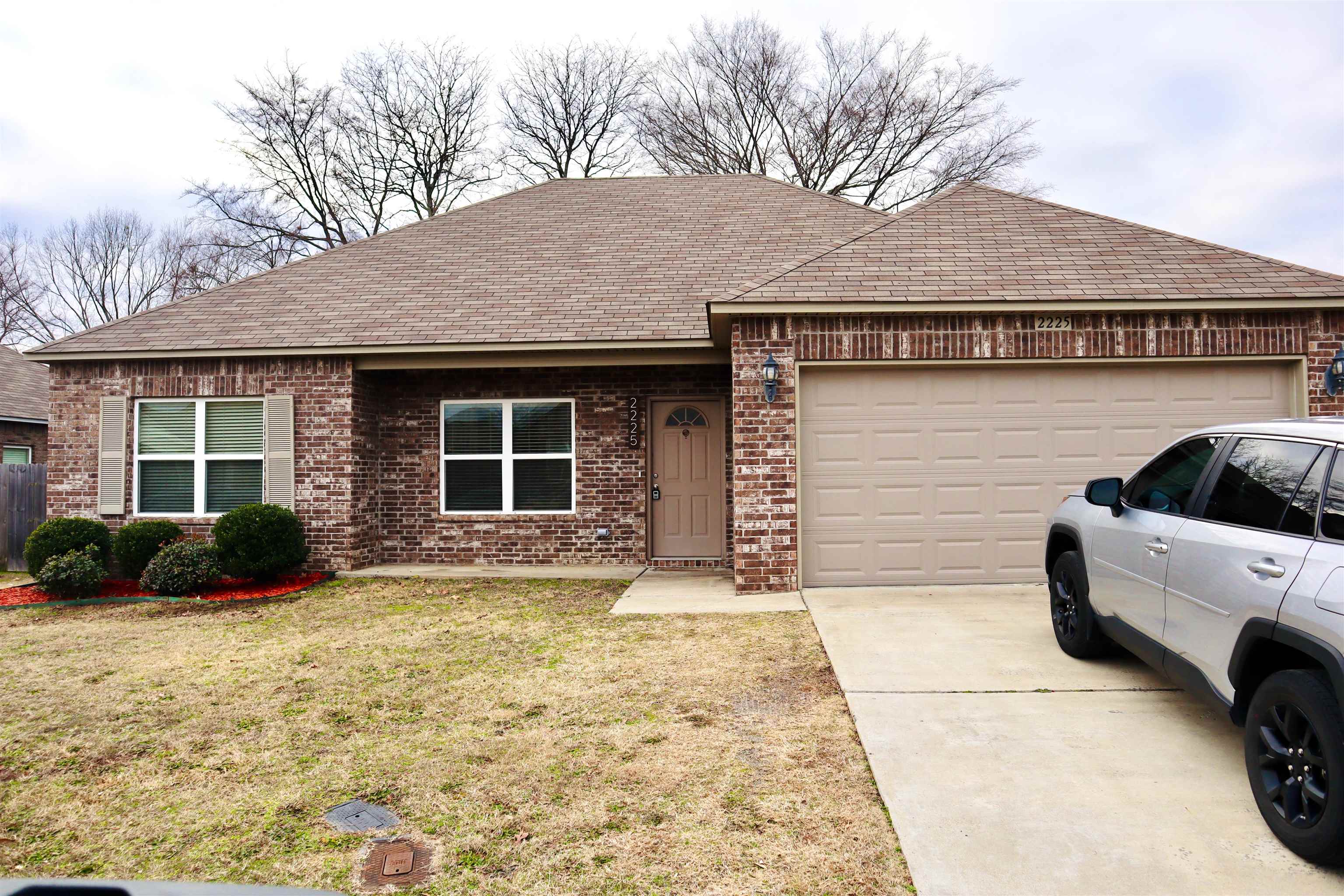 This charming brick home features 3 bedrooms and 2 bathrooms with an open, split floor plan perfect for modern living. The spacious kitchen boasts stainless steel appliances, and the home includes a separate laundry room for added convenience. The master suite offers a walk-in closet and a private bathroom. The fenced-in backyard with a concrete patio provides a great space for outdoor relaxation. Located in a welcoming neighborhood, the home has a well-maintained exterior and a tasteful color scheme throughout.