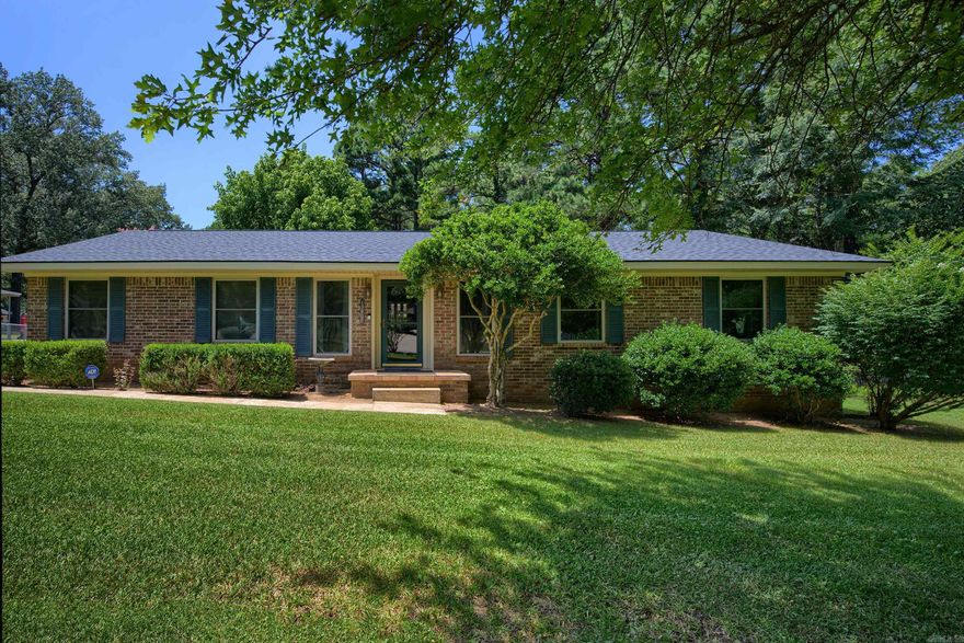 Charming Brick Home with Spacious Shop and Park-Like Yard. Welcome to this well-maintained brick home in a great location, offering both comfort and functionality. The large fenced backyard is a true retreat, features mature grass, a cozy fire pit, and a partially covered deck for relaxing or entertaining. Inside you'll find a welcoming living room with durable laminate flooring. The kitchen is thoughtfully designed with a center island that provides extra space for cooking and gathering. A standout feature of the property is the over-sized shop/additional garage, complete with a floored upstairs loft--ideal for extra storage or the perfect space to create a game room, hobby area, or home office. Roof replaced 2023. AGENTS SEE REMARKS