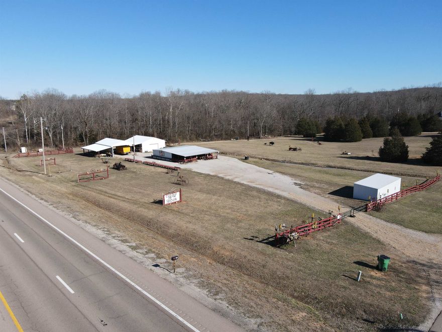 Commercial Business in a Prime Location! This is a turn key business opportunity in a high traffic area sitting on 2 +/- acres with a 40x30 shop building that has two walk in coolers, a building that has plenty of shelves for produce during the season or anything you are wanting to sell. Pole barn with plenty of space to store a motor home. There is also another building perfect for storage. Seller is leaving most of the inventory and lots of items on the property. Property currently uses a well, city water is available if desired. City water is available. All of this sits in an extremely prime location with several Ash Flat businesses in close proximity.