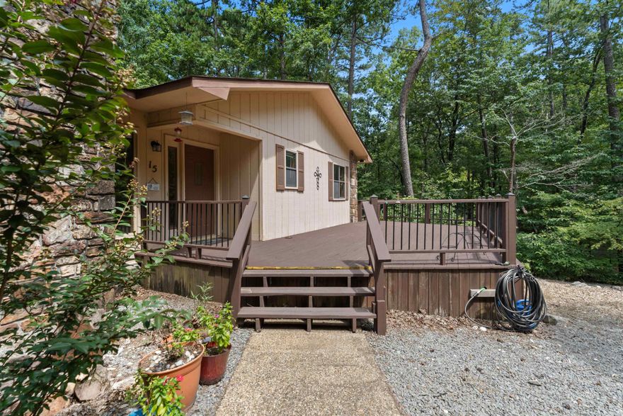 Located on a quiet cul-de-sac in Hot Springs Village with tons of privacy, yet close to the West Gate. This property features mature trees, a spacious front deck, and a fenced yard perfect for pets. Inside, enjoy a cozy living area with a fireplace and wood-beamed ceiling, plus a heated and cooled Arkansas room for year-round use. Floor plan offers 2 bedrooms and 2 baths, along with a flex room that can serve as an office, laundry room, or additional bedroom. Kitchen has updated stainless steel appliances.  Both bathrooms have been updated. 2 car garage with room for extras!  Roof replaced 2022, this is a wonderful home with plenty of space to make it your own!