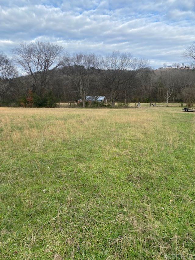 Interior lot in White River Estates of Izard County Arkansas. Subdivision is on the White River in Sylamore just minutes from Mountain View, Arkansas. Public Boat Ramp is within walking distance. Nice level lot ready to build your vacation or forever home. Restrictions to protect your investment. Great view of surrounding mountains! Paved streets with electric and phone at the road. Will need septic. Gas will be propane.