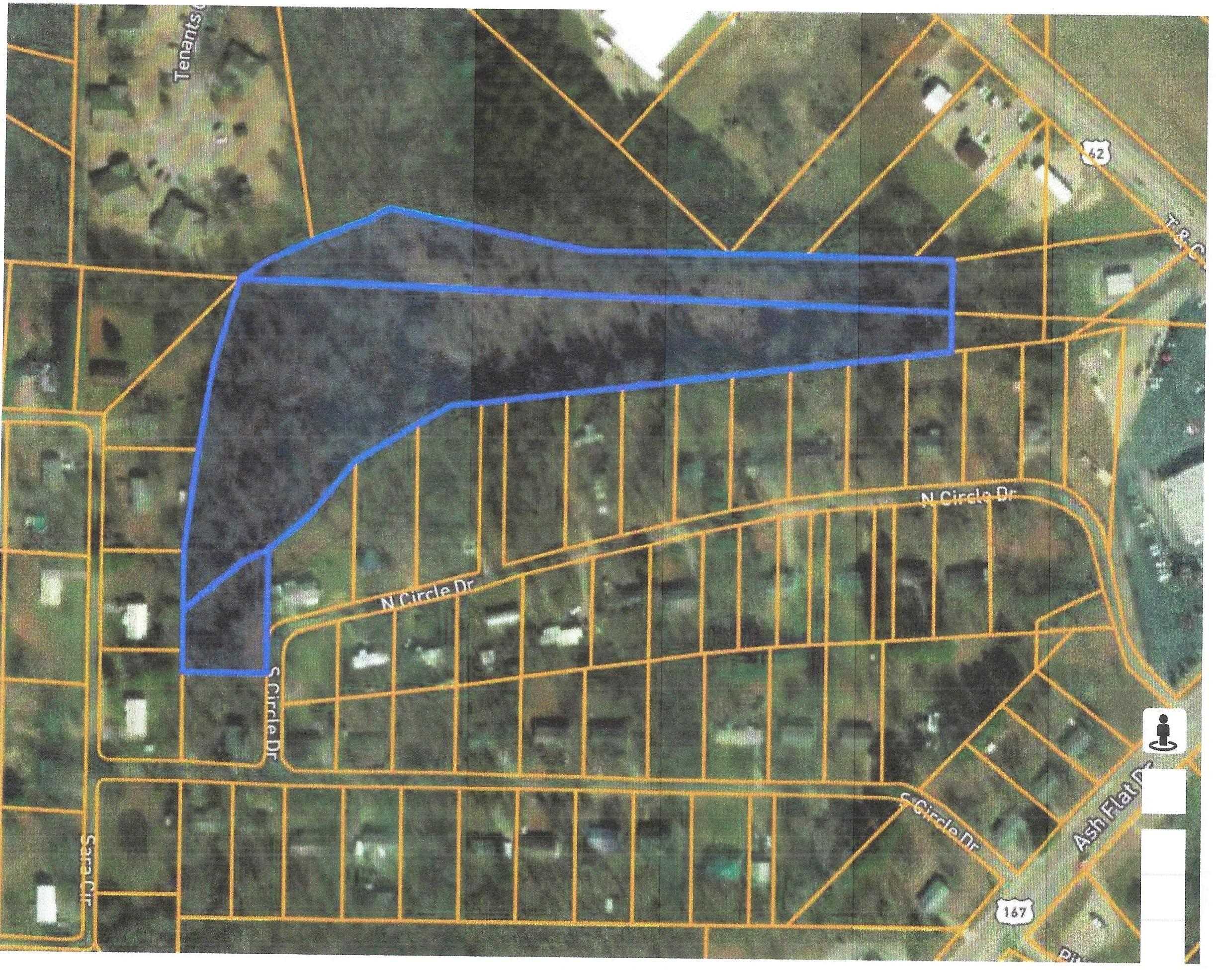 This 9 wooded acres is located in the middle of Ash Flat. Purchase includes a lot in Northside addition on N Circle Drive to access the property. Would be plenty of land to build your dream home or with city council approval and Planning and Zoning with Ash Flat, build a couple of houses for investment. City ordinance allows for 2 horses, 2 cows, 6 goats or sheep or 20 fowl per 3 acres of land. So you could have a mini farm on this property. Call for written city ordinance requirements. City water and sewer are in this area, again subject to city approval. Great location and this type of property does not come along very often in the city of Ash Flat.