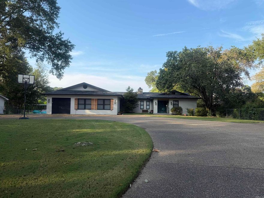 Welcome to 255 Long Beach Pt, Look no further for your lake oasis this is it, located right out of city limits so perfect for nightly rentals or your private lake home this one features 4 Bedroom, 2 Bath, 129' feet of Lake frontage, 1 Book slip W/lift, private boat ramp, large master suite, 2 jet dock for jet skis, large covered deck, large open kitchen, gas log fireplace, zoned HVAC, open floor plan, irrigation system, detached garage, attached garage perfect for golf carts etc, Beautifully manicured yard w/circle drive w/security gate