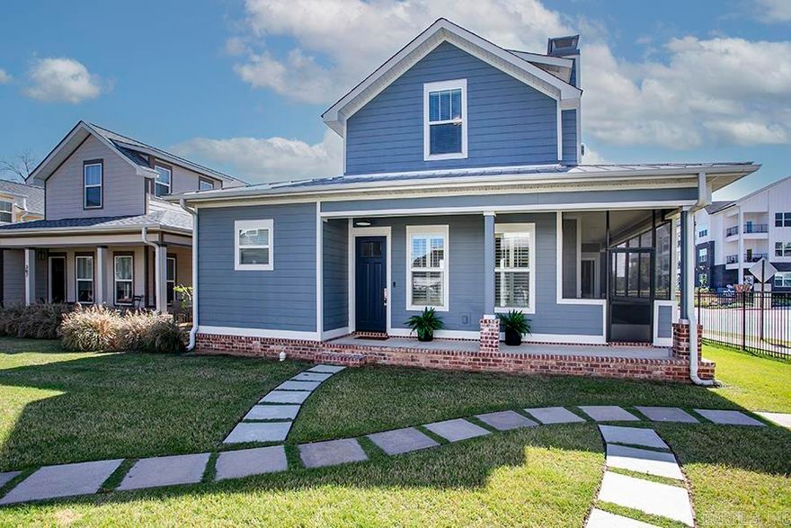 Charming and fresh, this Porches of Rockwater home is located just steps from the Arkansas River Trail and minutes to Argenta and downtown Little Rock/NLR. Open-concept floor plan with 10' ceilings. Welcoming kitchen with abundant natural light and breakfast bar. Wonderful main level primary suite, Pella windows/doors, LVP flooring, gas fireplace, and quartz countertops. Main-floor also has nice bright laundry room and half bath. Upstairs landing perfect for small desk, sitting area or library with two nice size bedrooms and a full bath. Enjoy entertaining and relaxing on the screened-in side porch. Home has metal roof, rear-loading garage, and welcoming front porch. HOA covers lawn care, fire pit, and fencing.