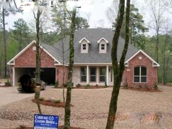 This house looks brand new. It has been lived in only a few weekends!! Warm & richly appointed home on beautiful Balboa GC is sure to please. Among the many amenities granite countertops, custom crafted cabinetry & stainless appliances in kitchen, generous amounts of crown mouldings & trim, gas log fireplace, hardwood & ceramic flooring , all brick/Austin stone exterior and a 2-car + golf cart garage all on a prime landscaped lot. PRICED $60,000 UNDER THE ORIGINAL SALES PRICE!!!