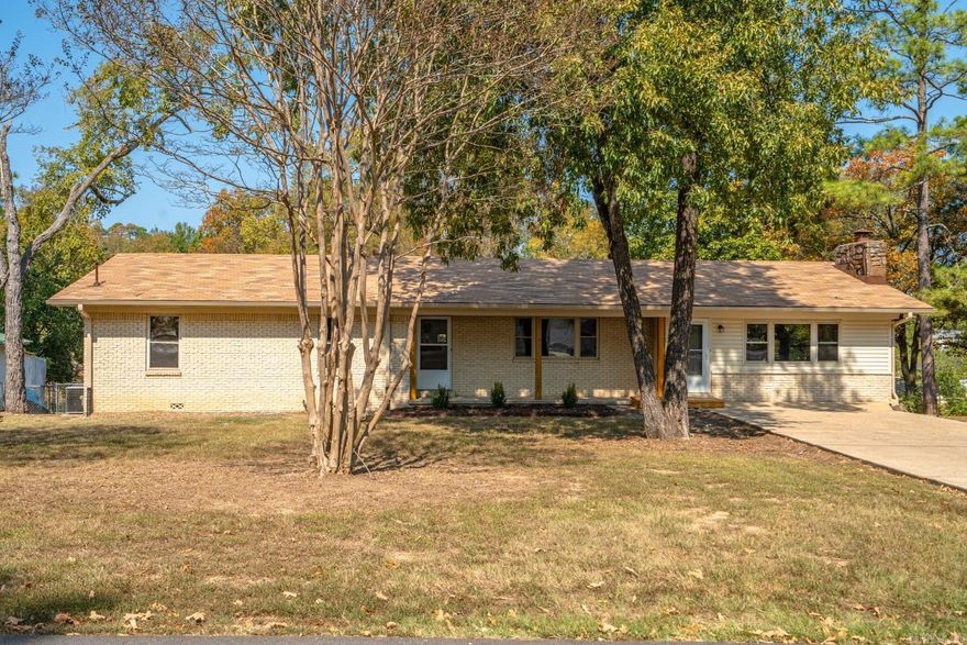 Don’t miss this freshly updated ranch with Lake Hamilton frontage in Lakeside School District, PRICED UNDER $150 per sq ft! Updates include new roof, fresh paint throughout, refinished hardwoods, LVP, new custom shower, new stove, and insulated windows. Enjoy playing and gardening in the XL backyard. Spend your afternoons fishing from the bank of Lake Hamilton and your evenings relaxing by the fire. The walk-in level hosts nearly 2,100 sq ft of everyday living space including the home’s 3 bedrooms and 2 bathrooms, living room, dining room, oversized kitchen, sitting area, and laundry room. Downstairs is a clean slate of 2 rooms ready for use as a game room, office, media room, craft or home-schooling space, etc. The backyard is HUGE and ideal for a garden, pets, and kiddos to play. So many options and so many memories to be made! This is a big “bang for your buck!”