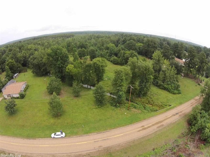 Searching for the right property to build on in the Arkadelphia School District?  Located in Caddo Valley near the Caddo River and the Lower Lake Dam - This is an ideal location offering flat to gently sloping land with a creek!!!  The property runs deep, which will allow for building in a more private location.  Lots of shade trees, wooded, and cleared sections along the property.  At this price, you owe it to youreself to view this property today!