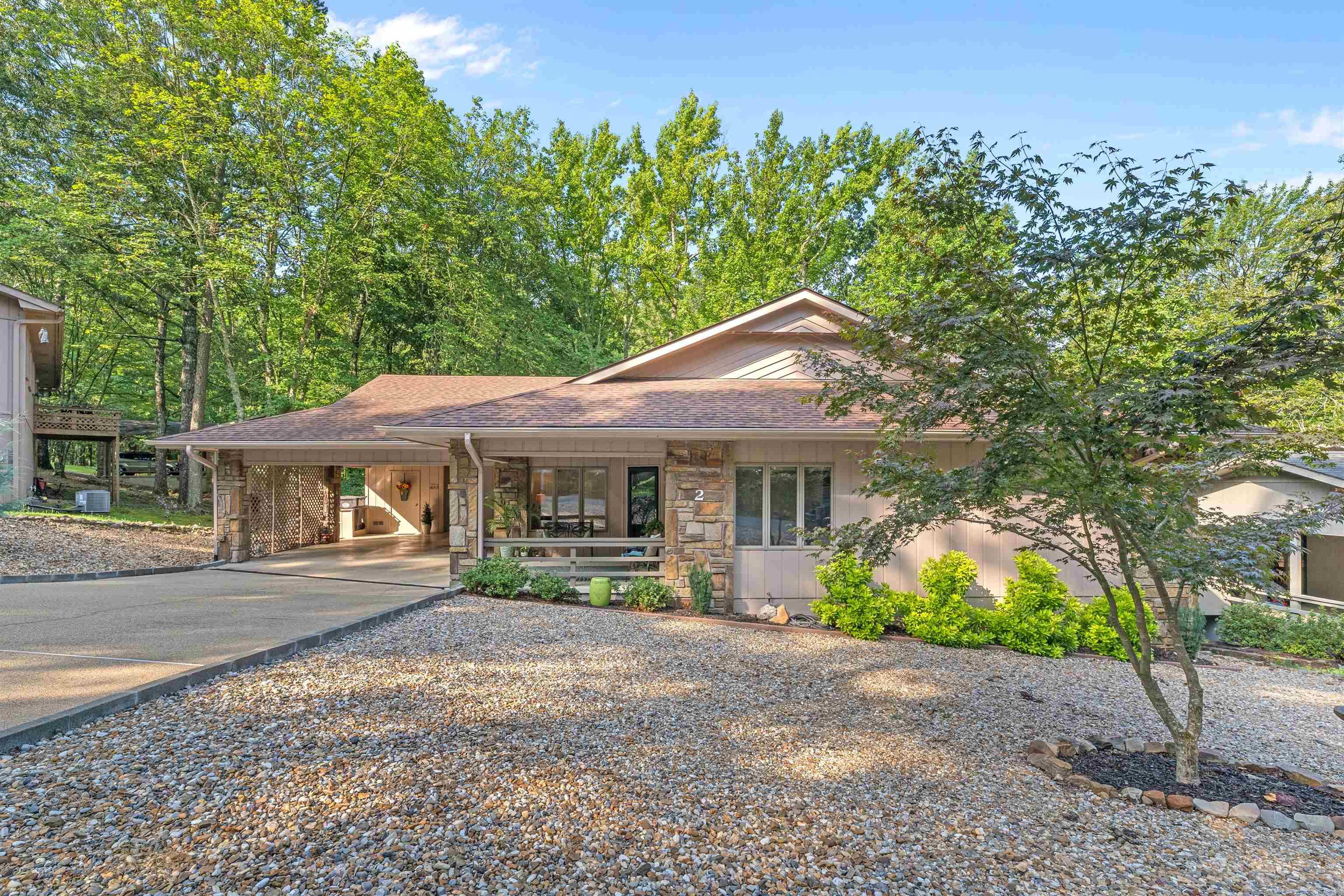 Welcome to your charming retreat in the heart of America's largest gated community! This well-maintained home features a stunning natural stone fireplace in the spacious living room and a bright sunroom filled with windows. The kitchen includes a sunny garden window, generous pantry, and a flexible space ideal for a breakfast nook, office, or mudroom. Enjoy peace of mind with a newer roof and encapsulated crawlspace. Outside, relax on the peaceful deck overlooking a low-maintenance landscape. This home isn't just a place to live-it's a lifestyle. Enjoy top notch community amenities including golf, tennis, pickleball, hiking, and countless social events. Don't miss your chance to own a special piece pf Hot Springs Village! Schedule your showing today!