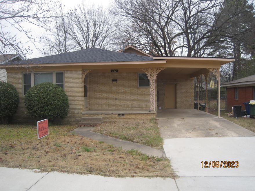 Cute house all brick 3 BR, 2 BA, Decorative fire place/non functional, lg den with sky lights, hard wood floors, carpet, new roof, repairs to laundry room, and carport form Tornado, CH/A. Great for First Time Home Buyers. Flood insurance required. Property sold "AS IS". Agents see remarks!