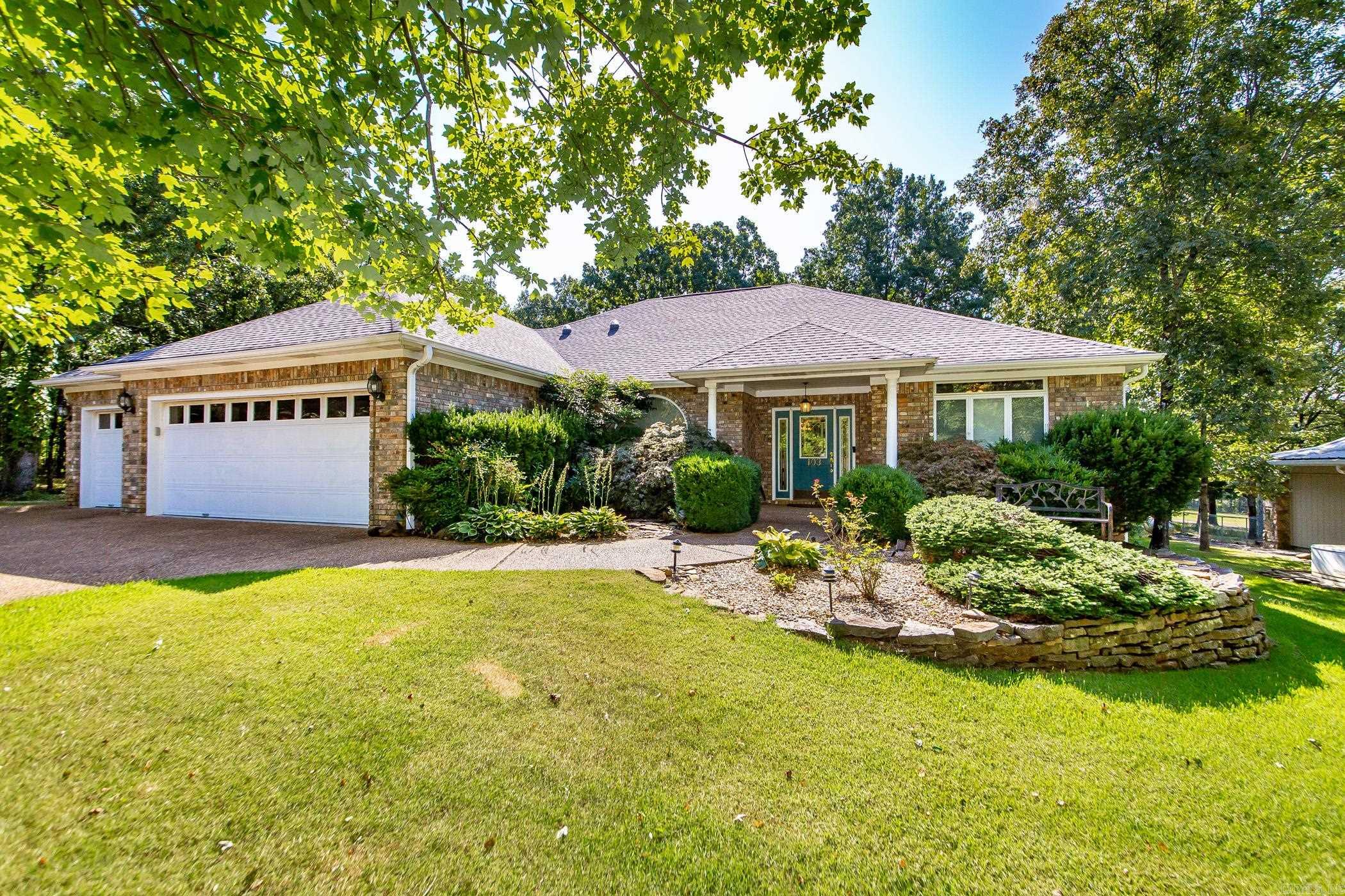 Effortless single-level living meets the best of golf-and-lake life on the 4th fairway of Indian Hills. This impeccably maintained, all-brick home blends low maintenance with thoughtful updates & energy efficiency. Gather in the welcoming hearth roomāanchored by beautiful fireplaces & a custom white oak mantleāor unwind in the screened room while you watch golfers roll by. Dual-fuel heat & excellent insulation provide year-round comfort & lower utility costs. The oversized 3-car garage easily fits vehicles, tools, and a golf cart, & a dedicated cart path connects you straight to the course. Minutes from a nearby boat launch for instant lake access. With timeless curb appeal, flexible entertaining spaces, & true one-level convenience, this home delivers the easy, refined lifestyle youāve been looking for. The expansive master suite offers a office area for working from home. Also there are his & her walk in closets. This home also has fiber internet. The kitchen features a butlers pantry & pantry. There are also cabinets with pull out drawers in the kitchen & laundry room. Close to the amenities of the bay including pickle ball, 3 swimming pools, hiking & utv trails.