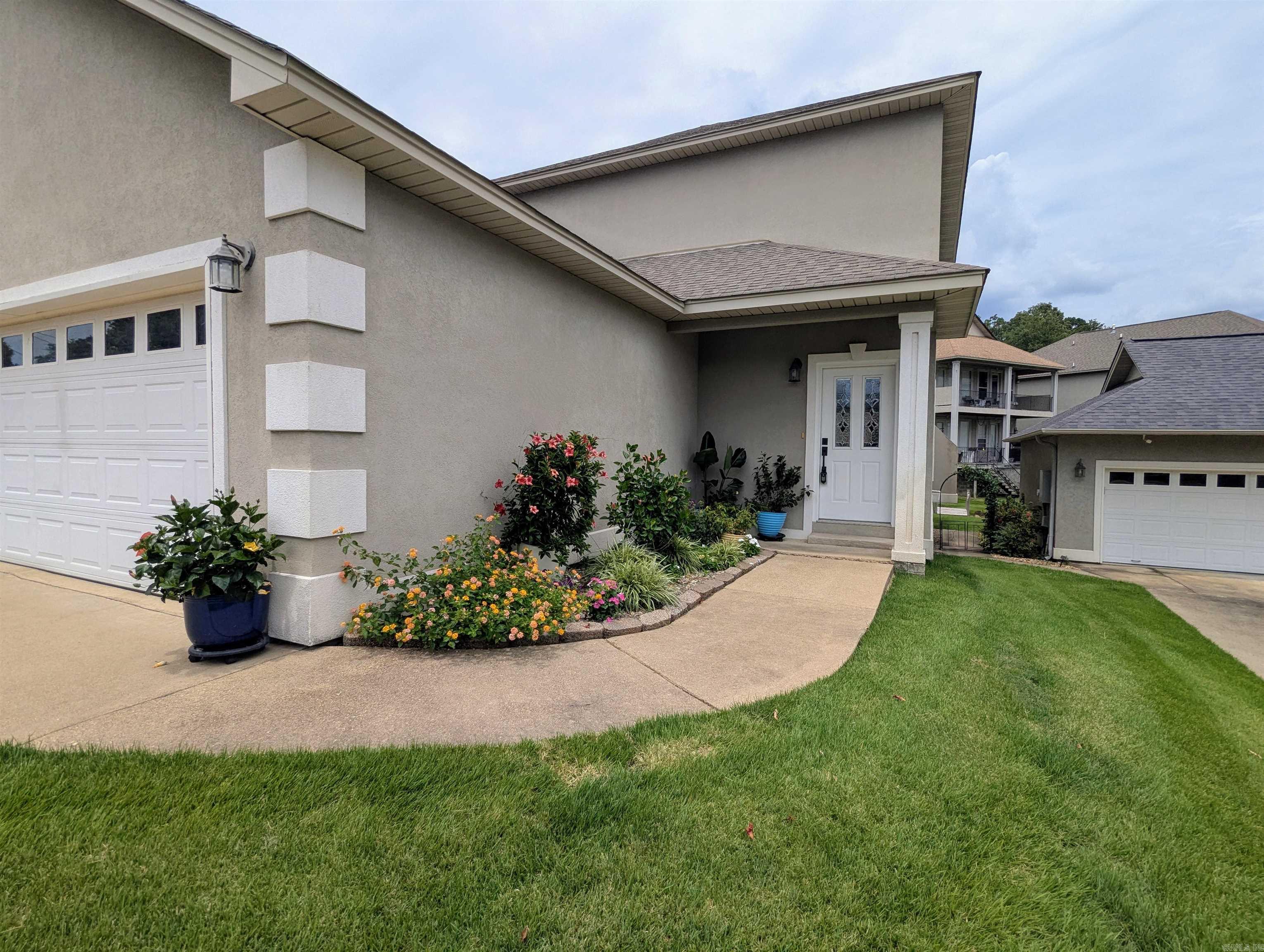 Just back on market, folks! This gorgeous lake house presents the perfect opportunity for you to own a piece of paradise for the REDUCED PRICE of $485,000! Located inside the peaceful gated community of Lighthouse Cove, less than 5 minutes from Walmart on Central Avenue. Granite countertops, beautiful boardwalk, and views of Lake Hamilton! With its 2 living areas, 3 extra-spacious bedrooms, 3 1/2 bathrooms, and TWO covered decks, this home loves company and will rise to every occasion.