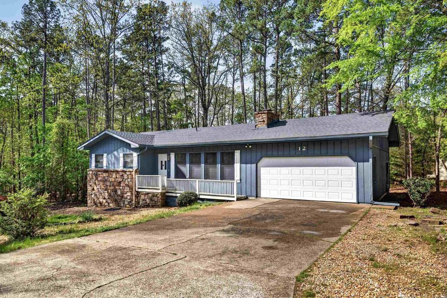 Nice curb appeal in a quiet neighborhood only minutes from the West Gate. Flat driveway and common property to the rear. Two bedroom, one full bath and half bath in primary bedroom. Carpet in bedrooms only. No popcorn ceilings in living room and kitchen. Separate laundry room. Kitchen/dining area open into nice size living room with wood burning fireplace. Rear deck. Two car garage with storage room. New roof in 2023. Refrigerator and washer & dryer convey. Optimum cablevision for tv and internet. No Seller Property Disclosure is available. The home is move in ready, but it is selling in "as is" condition. Buyer still has the right to conduct a home inspection for informational purposes. Call Showing Timefor appointments. 501-244-0333