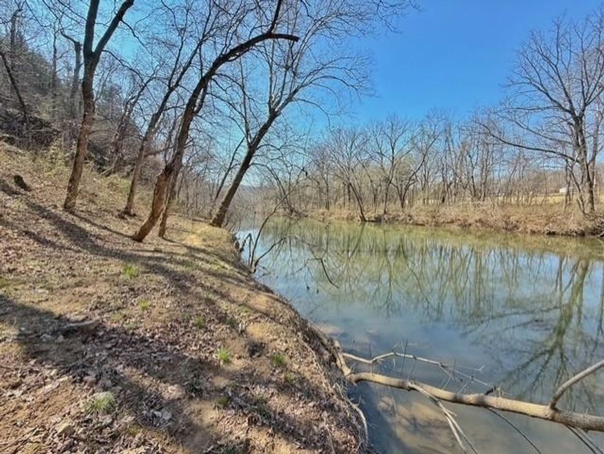 Riverfront lot on the South Fork of the Spring River in Cherokee Village, Arkansas! This 150x285 wooded lot with approximately 150 feet of river frontage offers a prime setting for your future home or getaway in the heart of Spring River Country. The property features a beautiful hilltop homesite overlooking the river, providing both privacy and scenic Ozarks views.  Located in Cherokee Village, this property gives you access to area amenities along with nearby lakes including Lake Thunderbird, Lake Sequoyah, Lake Cherokee, Lake Omaha, and Lake Sherwood. Enjoy fishing, kayaking, and outdoor recreation right from your property or just minutes away.  Whether you're looking to build a weekend retreat or full-time residence, this riverfront lot in North Arkansas offers the ideal combination of location, natural beauty, and value.  Don’t miss this opportunity to own riverfront property in the Ozarks!