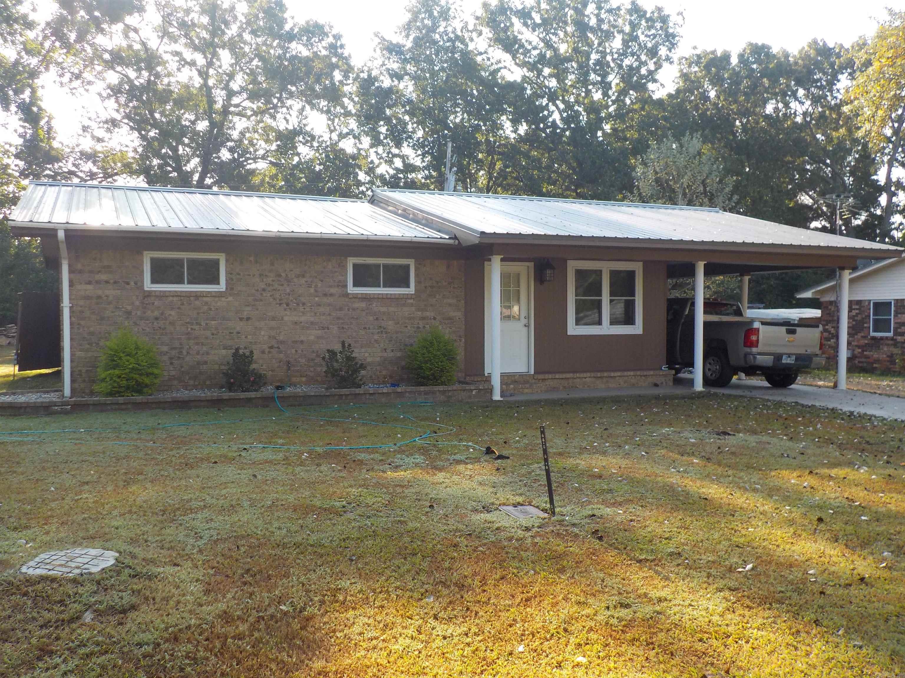 Remodeled ranch styled home with 4 bedrooms, 2 baths, updated kitchen w granite tile countertops, 2 electric LED fireplaces, huge laundry room, privacy fenced yard with dbl gate, large covered patio for entertaining, would make a great shop if enclosed, storage shed, 2 car carport. Newer metal roof and exterior paint, new windows, good curb appeal. Don't miss this one!