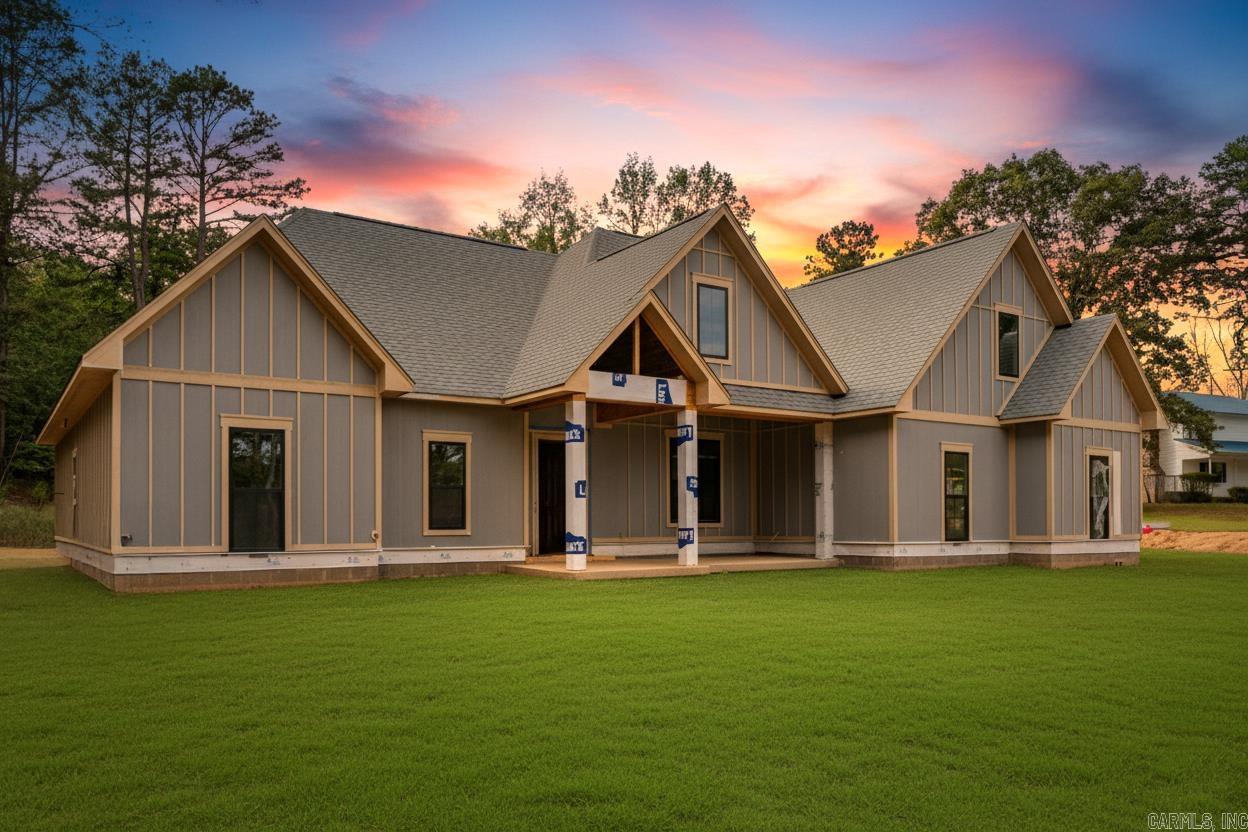 Brand new construction on 1.53 acres with Lake Hamilton access, directly across from the neighborhood boat ramp! This beautiful home features arched doorways, vaulted ceilings, and an open floorpan perfect for entertaining. The kitchen is a chef's dream with 36" gas stove, custom cabinetry, and ample counter space. Includes a large laundry room, butler's pantry, and extra storage room in the garage. Upstairs offers a spacious bonus room with a reading nook and full bath. Brick and board and batten exterior complete this stunning home! Call today!