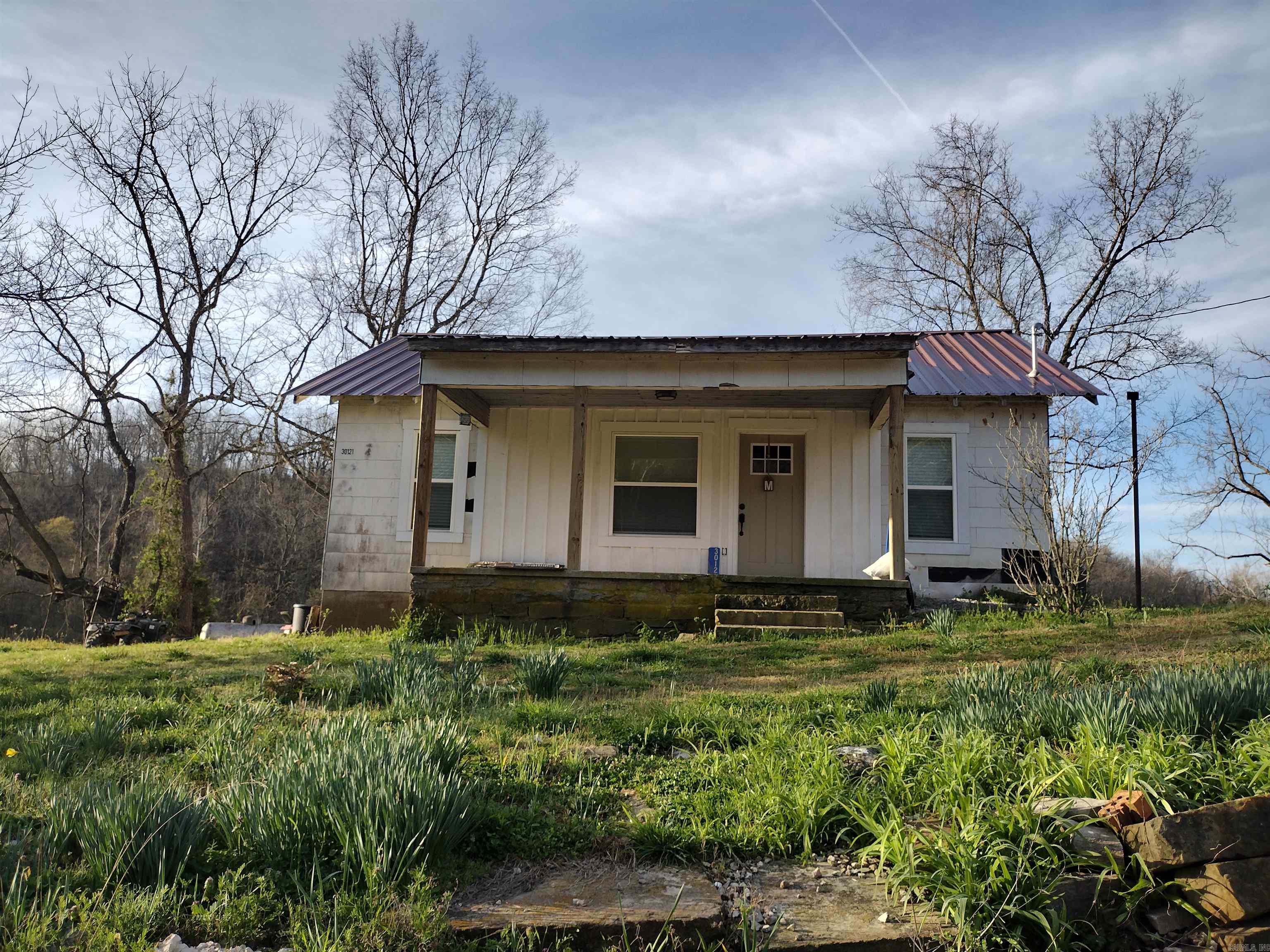 The inside of this home was completely remodeled approximately 2 years ago. Has all new wiring, plumbing and was spray foam insulated, Upstairs has a bathroom and large room with divider wall that can be used to separate beds. Has a wet Weather creek going through property with some pasture and lots of large hardwood timber for wildlife, lots of deer and turkey on this property.