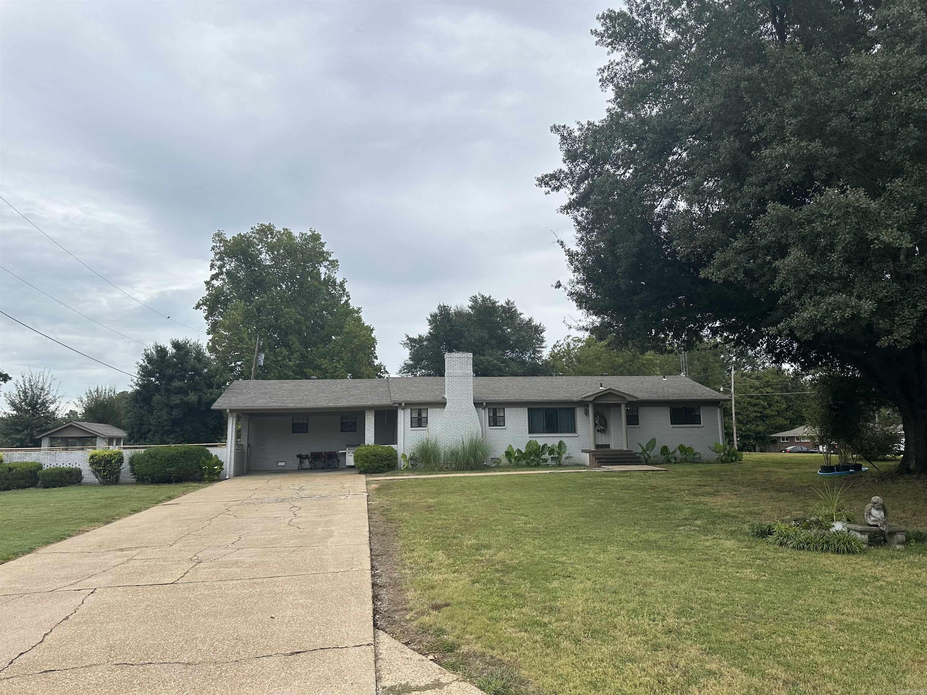 New to the market is this meticulously maintained home on a large corner lot. This home is 3 bedrooms 1.5 baths. Approximately 1800 sq. ft. Flooring is hard wood, ceramic and laminate. Kitchen has been updated and offers lots of cabinet space, granite countertops, freestanding icemaker, Gas range and double oven. Dining room joins the living room for all of your entertainment needs that has a gas burning fireplace. The laundry and pantry are all in one and has plenty of space for storage. Bedrooms are roomy, with nice closet space. Exterior of the home is brick, double car carport and detached garage. Large fenced in yard that has a gazebo! Whole home generac generator. This home has so much to offer! Great for a first time homeowner! Give us a call to see this property!