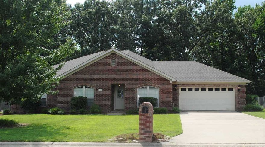 This beautiful 3 BR, 2 BA home is a must see!  The kitchen has gorgeous custom built stained cabinets, stainless steel countertops, tile backsplash and stainless steel appliance.  The oversized living room features a stone gas log fireplace and trey ceiling.  The master bath has a tiled shower, jetted tub and double vanity.