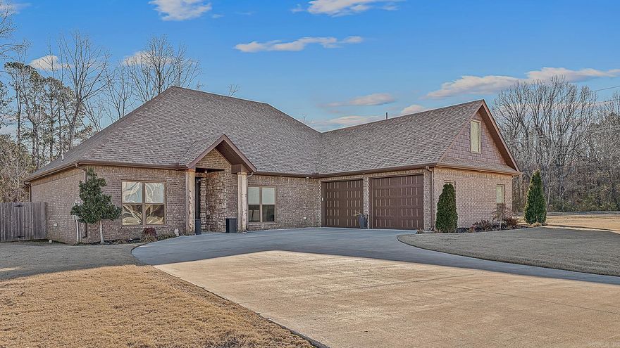 Custom built in 2020, this beautifully designed home offers thoughtful details and spaces made for everyday living and entertaining. The open kitchen is a true showstopper with white cabinetry, a massive 9-ft granite island with seating, double built-in refrigerator/freezer, double ovens, added coffee bar, and breakfast bar—plus an additional breakfast room and formal dining area that could easily function as a home office. Neutral décor throughout creates a timeless, inviting feel with room for everyone to gather. A sunroom/den at the back of the home adds flexible living space overlooking the backyard. Outdoors features a 12x16 covered deck, iron fencing across the back, and privacy wood fencing on the sides. The spacious primary suite is a retreat of its own with a spa-like bath featuring a rain head shower and champagne gold fixtures. The half bath stands out with charming black-and-white tile flooring. Additional highlights include a 2-car garage with 8-ft-tall entry doors and walk-to attic storage above the garage. A must-see home with quality finishes and smart design throughout.