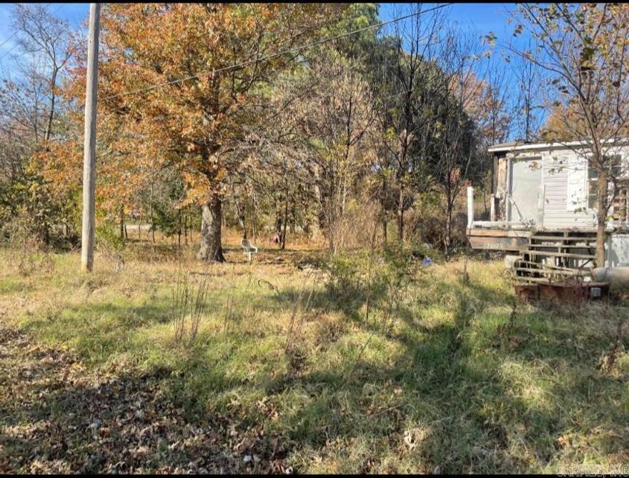 Investment opportunity! This 3-bedroom, 2-bath mobile home sits on a spacious 0.63-acre lot and is being sold AS-IS for cash only. The home is in poor condition and needs major repairs or removal, but the property offers great potential for someone looking to start fresh. With utilities available and plenty of room to build or place a new home, this could be a great site for your next project. Located in a quiet area with easy access to nearby amenities. Bring your vision and make this property your own!