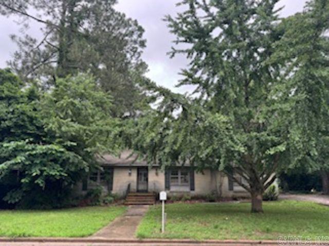 Investors take note! This split level house in a nice location features a large backyard, 2 bedrooms, 1 bath, kitchen, dining area and living room on the main level with a family room, 1 bedroom and 1 bath in the walk-out basement. After updates, this could be a wonderful family home! Spiral staircase and fireplace insert do not remain with property.