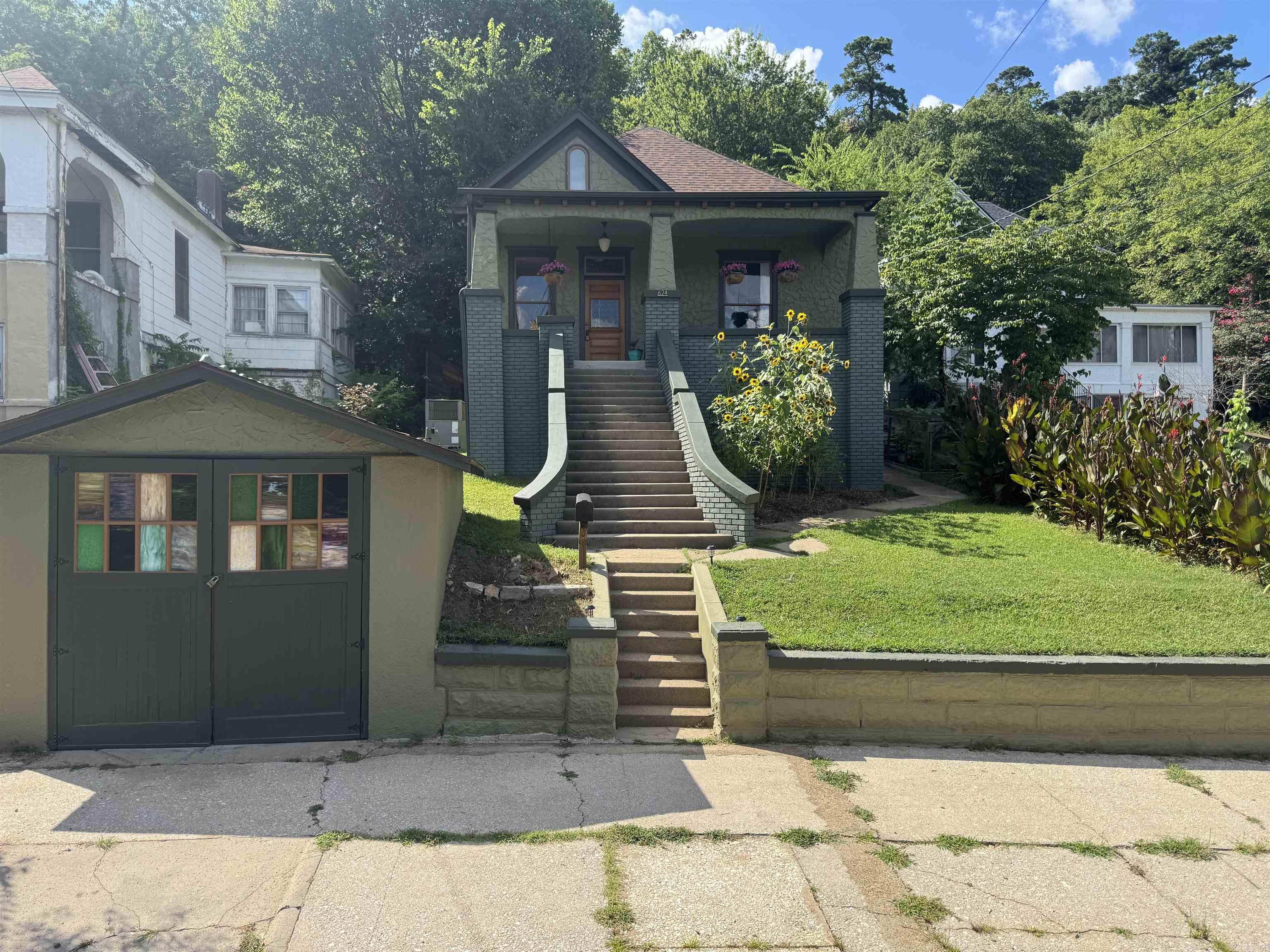 Charming and thoughtfully remodeled, this 2-bedroom, 1-bath home blends classic character with modern updates. Over the past 3 years, nearly every detail has been improved, starting with professional interior and exterior paint, a new roof and gutters, updated rear siding, and fresh tuck-pointing on the front brick.Inside, enjoy all-new flooring throughout, a fully remodeled bathroom featuring artisan Tadelakt plaster, and a stylish kitchen with new cabinetry, solid wood countertops, and all-new appliances. The upstairs boasts new drywall, updated lighting, and fresh flooring, while the basement includes new ventilation fans for added comfort.Step outside to your own backyard retreatātrees have been thinned to open up the space, a French drain has been installed for improved drainage, and custom touches like a pondless waterfall, enclosed vegetable garden, and stained glass garage door panels add beauty and charm. The refinished original front door and antique lighting tie it all together for a home that feels truly special. All this within half a mile of bathhouse row.