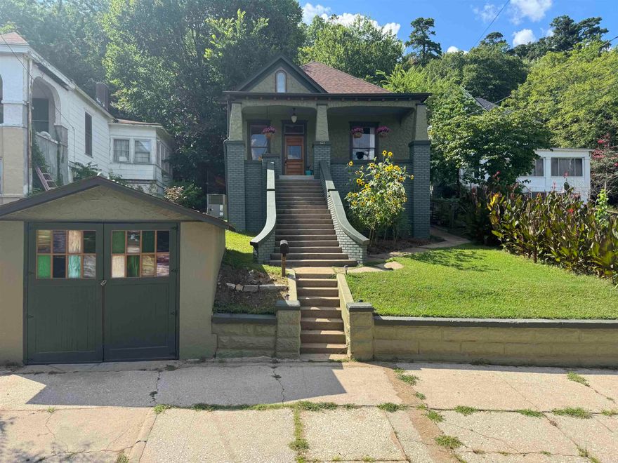 Charming and thoughtfully remodeled, this 2-bedroom, 1-bath home blends classic character with modern updates. Over the past 3 years, nearly every detail has been improved, starting with professional interior and exterior paint, a new roof and gutters, updated rear siding, and fresh tuck-pointing on the front brick.Inside, enjoy all-new flooring throughout, a fully remodeled bathroom featuring artisan Tadelakt plaster, and a stylish kitchen with new cabinetry, solid wood countertops, and all-new appliances. The upstairs boasts new drywall, updated lighting, and fresh flooring, while the basement includes new ventilation fans for added comfort.Step outside to your own backyard retreat—trees have been thinned to open up the space, a French drain has been installed for improved drainage, and custom touches like a pondless waterfall, enclosed vegetable garden, and stained glass garage door panels add beauty and charm. The refinished original front door and antique lighting tie it all together for a home that feels truly special. All this within half a mile of bathhouse row.AGENTS SEE REMARKS