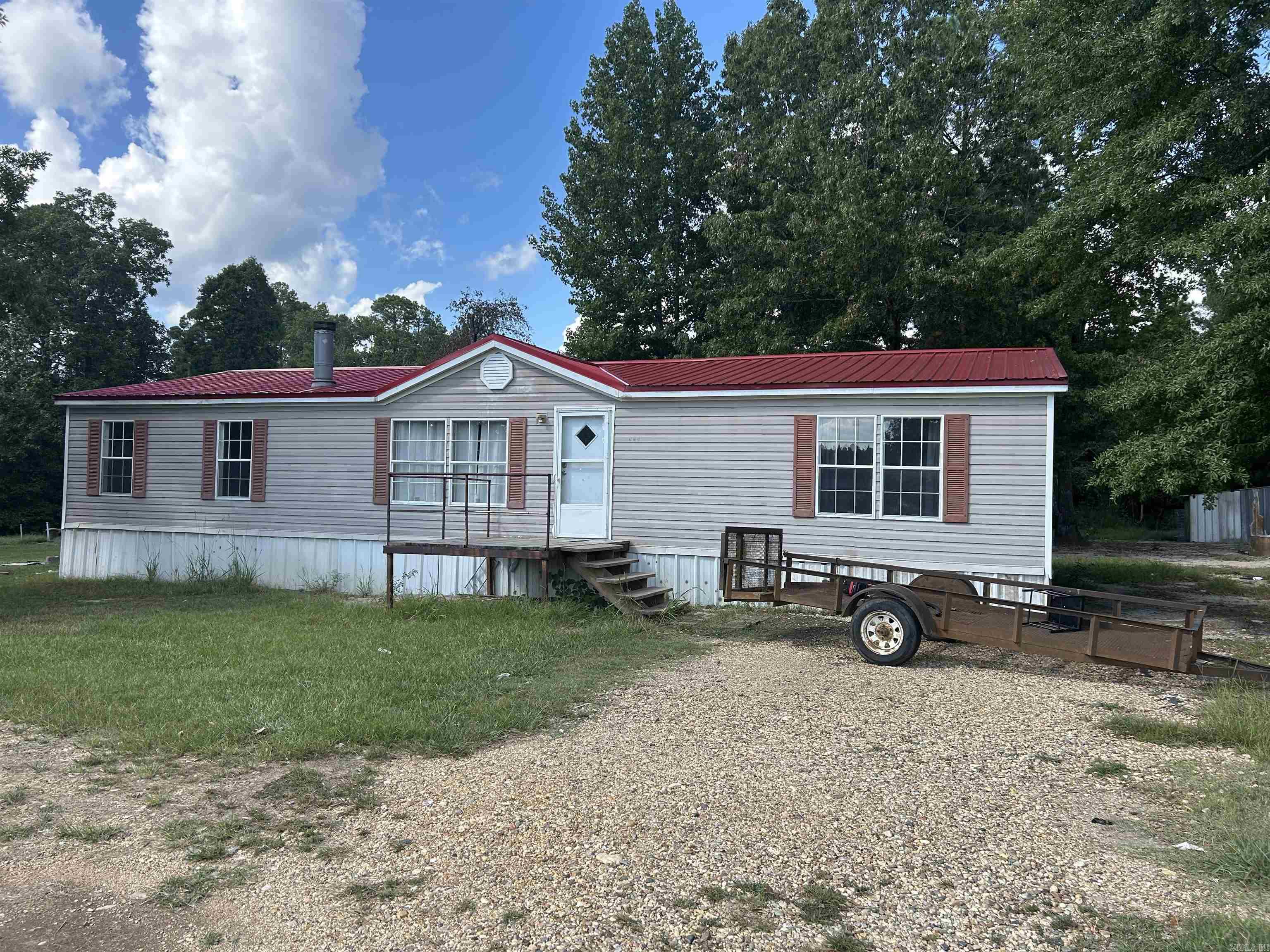 Quiet 5 acres with mobile home. Not far from town. Call me for an appointment. 870.314.2286