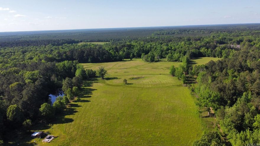 Looking for a place to build?  Here it is! Perfect place to hunt too. Mostly pasture land surrounded by timber.  Tucked back for privacy. There is a 20x20 concrete pad and a portable building 16x16 with a lean off  Over 27 acres of stunning pasture with timber surrounding.  Build your dream home here! This is the perfect opportunity at a great price!  There is a great spot for hunting & so many other possibilities without the large price tag. Seller is obtaining necessary deeded location for water meter & easement for utilities/access.  We have a current easement in place as well. Adding another for the buyers benefit. As soon as the survey is completed it will be uploaded.  Can ask agent for further details on that.  Make an investment in land and you won't regret it! Buy dirt!