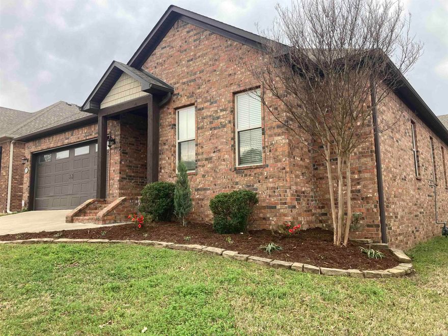 This home is nestled on a cul-de-sac in a small gated community located in West Conway. It's move in ready with new carpet in the bedrooms and new tile in the kitchen. One of the first things you'll notice about this home is the amount of storage and extra decorative built ins. The living room has a gas burning, corner fireplace so you have multiple options for furniture placement. The kitchen has beautiful white cabinets with lighted upper glass doors at the ceiling. There is a pantry as well as a large appliance closet in the laundry room. The primary suite is beautiful with the perfect layout in the on suite. There are split vanities, walk in tiled shower, huge soaking tub, and a walk-in closet. You'll enjoy your covered back patio and low maintenance backyard. The neighborhood has a private walking trail for you and your pets. This home is beautiful and ready for you to view today!