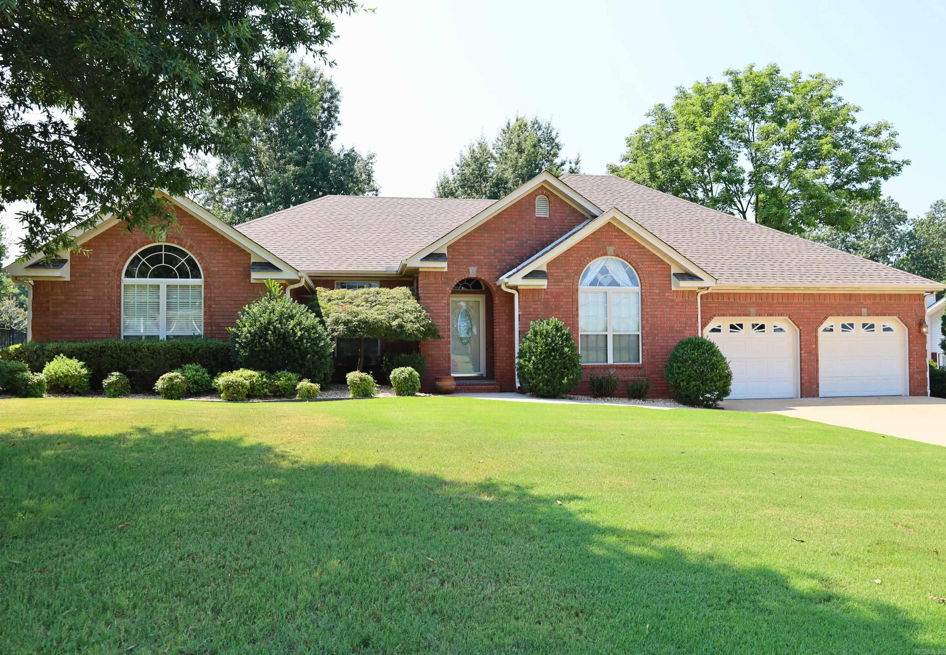 Experience the epitome of luxury in this stunning 4-bedroom, 2.5-bathroom home located along the Paragould County Club Golf Course. With over 2,600 sq ft of living space, this home boasts elegant bookshelf built-ins, an open-concept layout, formal dining room, granite countertops, and ample closet space. The primary bath features a jetted tub and dual vanity, with an additional 1/2 bath off the laundry room. Enjoy the picturesque golf course views from the back porch while entertaining guests or relaxing in the beautifully landscaped yard. The attached golf cart garage adds to the allure of this move-in ready, dream home. Don't waitāschedule a showing today!