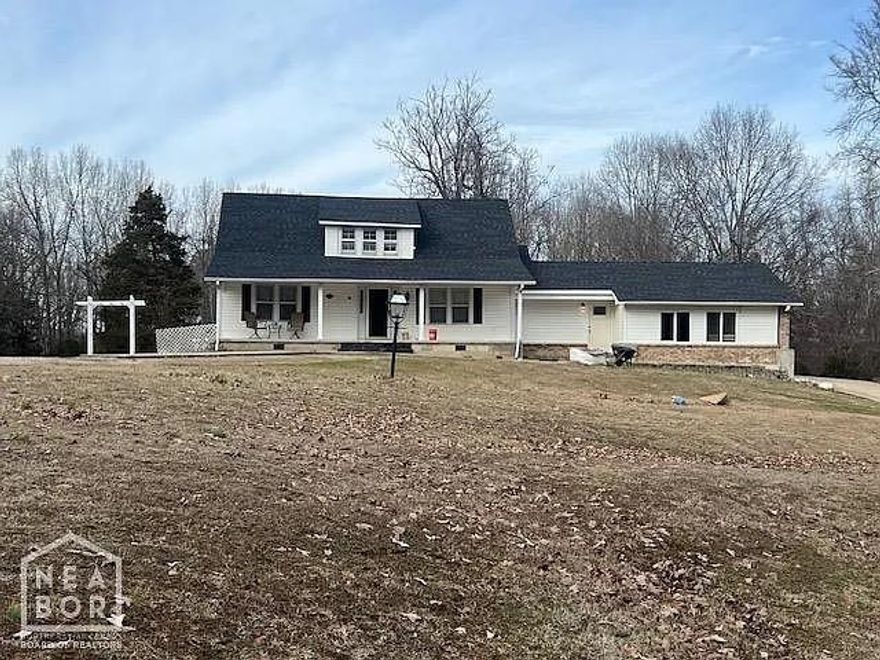 Nestled on approximately 2.14 acres, this beautiful home exudes a charming country ambiance that welcomes you from the moment you arrive. With four bedrooms and two full baths, it offers ample accommodation for families or guests. The kitchen, boasting a spacious eat-in area, is perfect for family gatherings. Additionally, the property features a convenient storage building for outdoor essentials. Inside, an additional versatile space awaits, ideal for use as a family den or a cozy man cave. Enjoy moments on the front porch or unwind on the covered patio in the back, soaking in the tranquility of the surroundings. Recent updates include Roof replaced February 2022, HVAC-November 2021. Addition was added in 2022. Don't miss the chance to call this inviting retreat your own. Schedule a viewing today and embrace the comforts of country living.