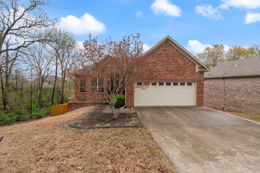 Split level brick with two decks. Brand new privacy fence. deck upgrades, new kitchen appliances, and side gutters all in 2023. Primary bedroom with en suite (remodeled 2022) on main level. Three bedrooms downstairs with full bath. Recent new wood flooring. New HVAC 2022. Buyer's agents, see private remarks regarding showings.