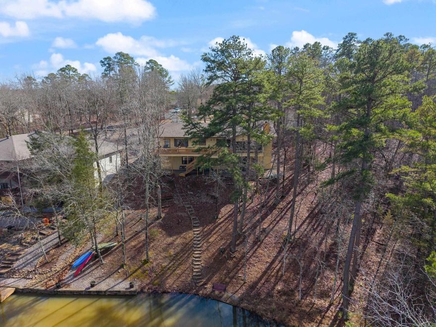 Waterfront living on Lake Pineda with a new roof (1/30/25)! This home has large rooms with new flooring throughout. On the top floor, enjoy stunning lake views from the den, dining area, kitchen, breakfast nook, and utility room. The basement includes a generously sized bedroom that can easily fit 2-3 Queen-sized beds, also with lake views. The expansive game room, perfect for a man cave or potential apartment, offers more lake views and is ideal for entertaining. Additional highlights include a wood-burning fireplace, an oak kitchen with a huge pantry, and sleek Quartz countertops. The third bedroom in the basement has its own full bath, making it a potential dual unit or VRBO, AirBnb, short-term rental. Fresh new tile flooring downstairs adds to the home’s appeal. The total living space is 3,021 sq ft, including the downstairs game room (note: the 160 sq ft Arkansas Room is not included in this measurement). Enjoy your backyard by kayaking, fishing, or cruising on a pontoon boat! The property also features a greenbelt on one side for extra privacy, creating a serene and peaceful setting. Recent updates include: new tile shower, all new HVAC,flooring, stove, paint, and much more!