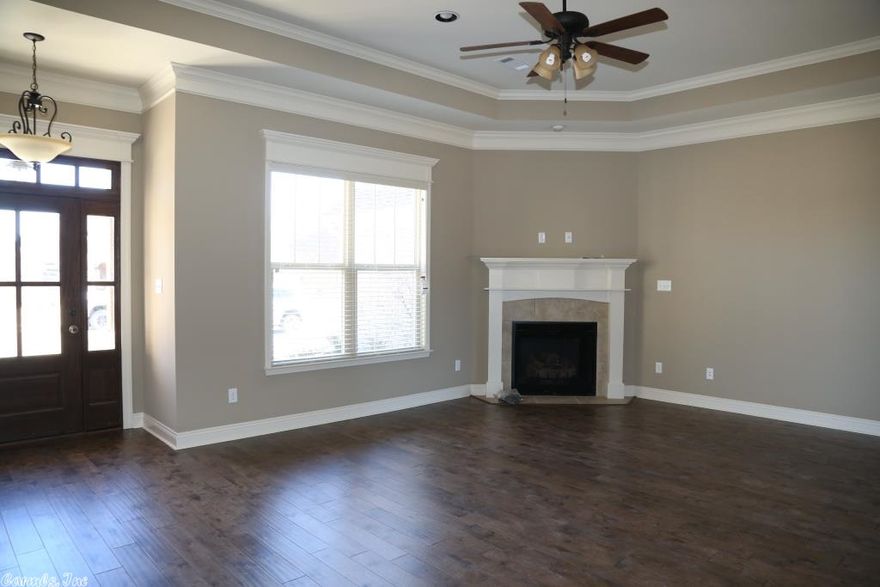 Great new all brick split bedroom floor plan home with 4 bedrooms and 2 baths. LOTS of wood flooring, gas log fireplace in living room, ceramic tile floor in baths and laundry. Kitchen is wide open to living room and has breakfast bar, custom built cabinets, granite countertops, lots of trim and crown molding throughout the home. Large master bedroom with his/her closets. Masterbath has whirlpool tub, separate tile shower and his/her vanities. Will be Certified Energy Efficient!