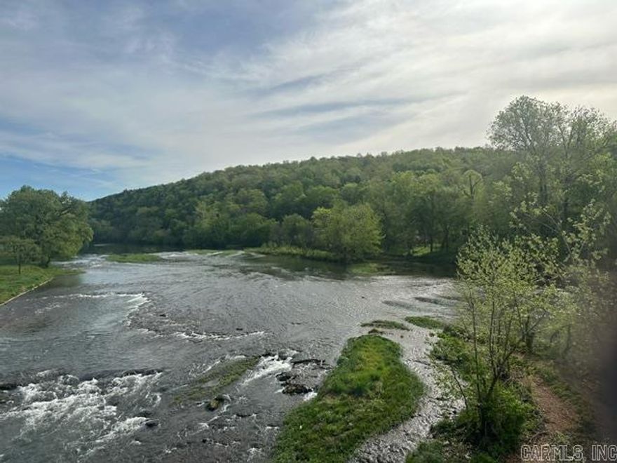 369' Riverfront Property on Spring River  Wake up to stunning views of the Spring River and mountains right outside your door.  Imagine having canoeing, kayaking, fishing, and endless outdoor fun just steps away on private river access in addition to community river access!  Hardy, Arkansas, offers the perfect mix of peaceful river living and small-town charm, with golf, hunting, and unique local shops close by.  For nature lovers who crave a slower pace, this is the perfect escape -- where the river is your front yard and adventure awaits.  Don't miss out!