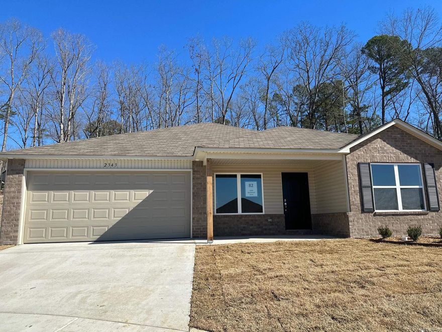 The ever-popular Carnegie II. A classic 4-bedroom, 2-bathroom split floor plan with an open concept. There is an eat-in Kitchen with a bar top, and the Master Bedroom is set to the rear of the home for more privacy.   Thoughtful upgrades included in this home: soaker tub/shower combo in Master Bathroom, plumbing faucet upgrade 2, crown on Kitchen cabinets, laminate flush bar top in Kitchen, Luxury Vinyl Plank flooring in wet areas, raised ceilings in Living Areas per municipal requirements, front door handle set upgrade, Cheyenne style interior doors, baseboards level 2, crown molding in living areas and Master Bedroom, LED disk lights in the Master Bedroom, full sod, stainless steel appliance package.   $100 initial assessment collected at time of closing.  Hilldale Crossing is convenient to HWY 5, the HWY 30/430 interchange, and Outlets of Little Rock.