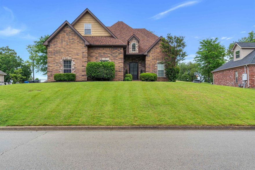Stunning updated executive home with sunroom and screened porch sitting on the 17th fairway.