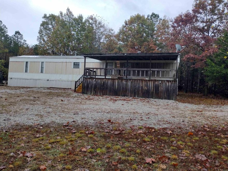 Discover a serene country setting just minutes from town on this 4.69 acres m/l property complete with a charming mobile home, storage shed and Conex container, perfect for a residence or investment